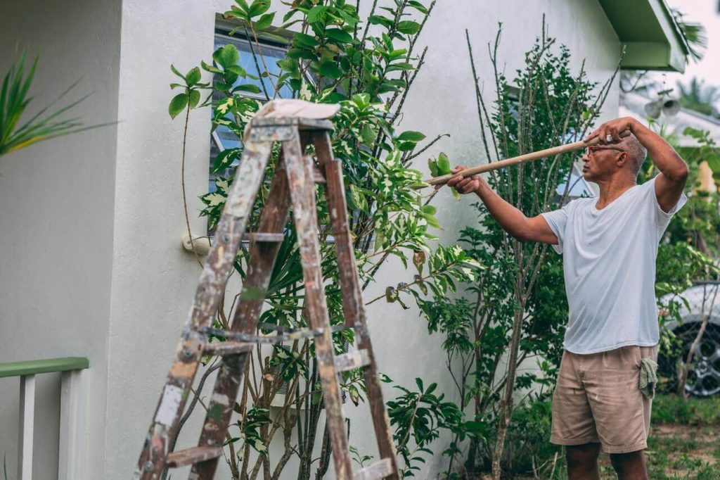 a man holding a ladder