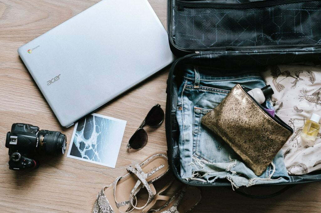 a laptop and a wallet on a table