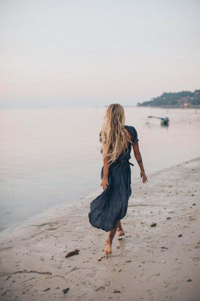 a person walking on a beach