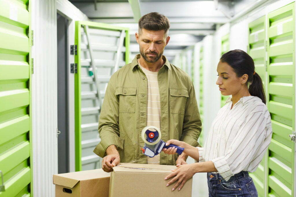 a man and a woman looking at a computer