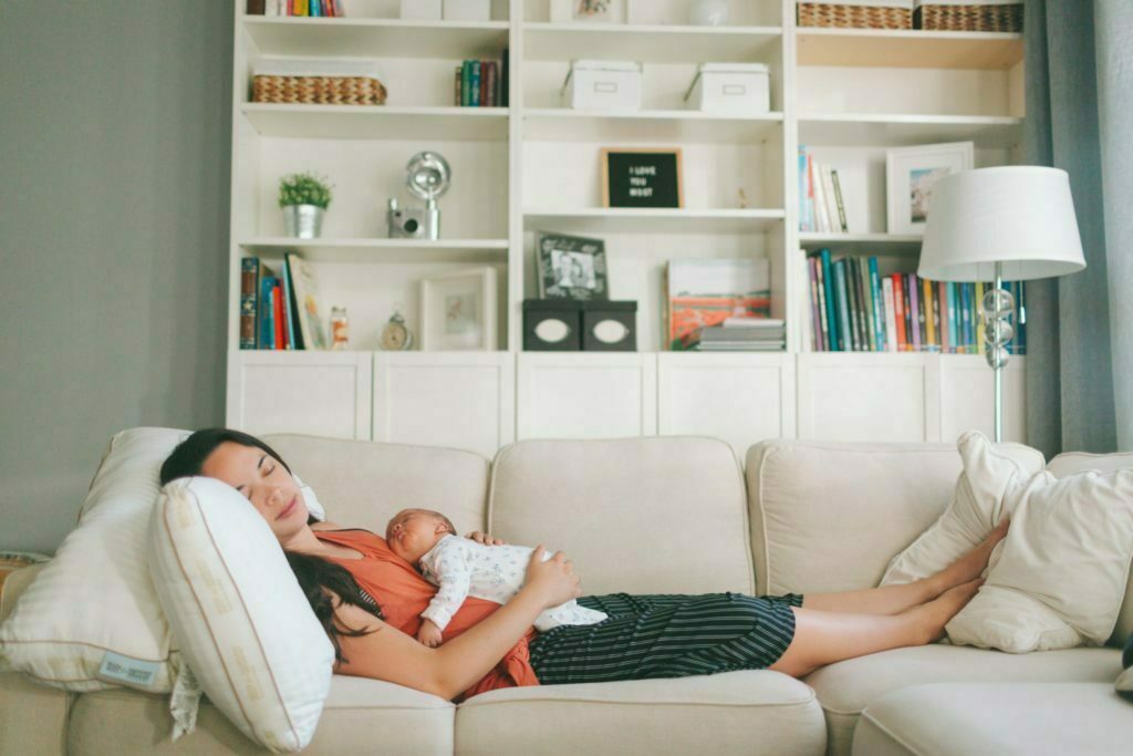 a couple of people lying on a couch