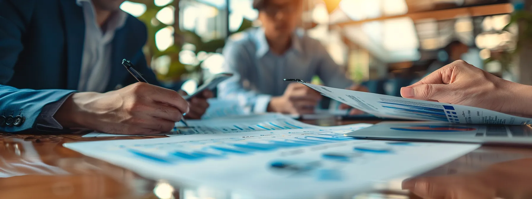 business professionals reviewing detailed packing list for annapurna circuit trek at a conference table.