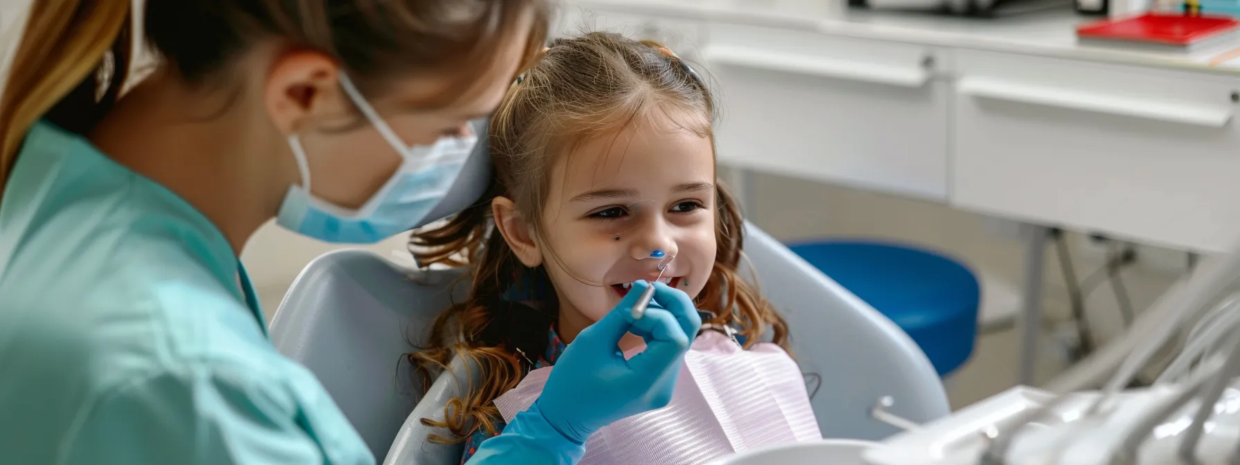 a professional pediatric orthodontist in fullerton examining a child's teeth with specialized tools.